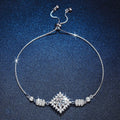 Bow Moissanite Chain Bracelet with CZ white background product photo showing bracelet silhouette and moissanite setting