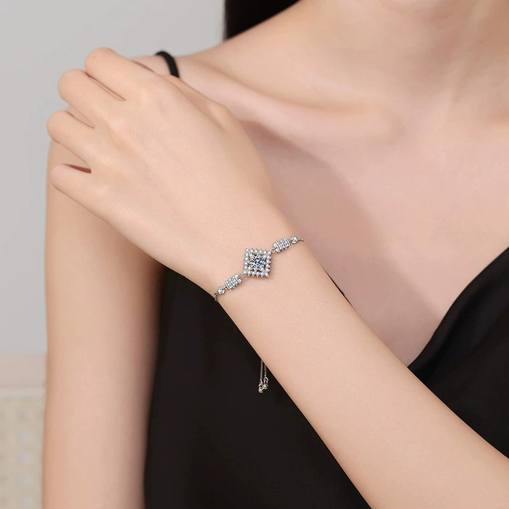 Bow Moissanite Chain Bracelet with CZ worn on wrist by model showing bracelet scale and fit
