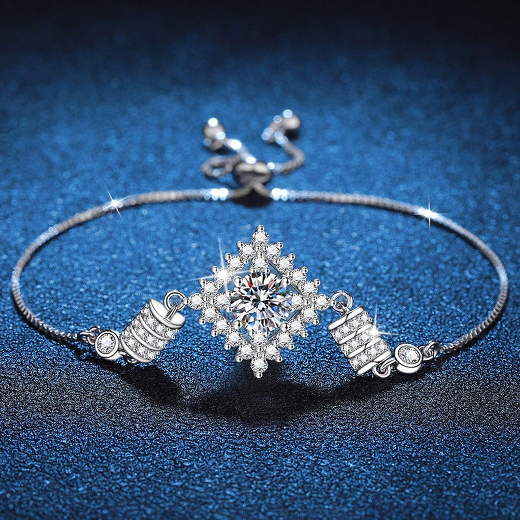 Bow Moissanite Chain Bracelet with CZ styled on blue display background showing moissanite sparkle