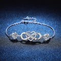Infinity Heart Moissanite Chain Bracelet with CZ white background product photo showing bracelet silhouette and moissanite setting