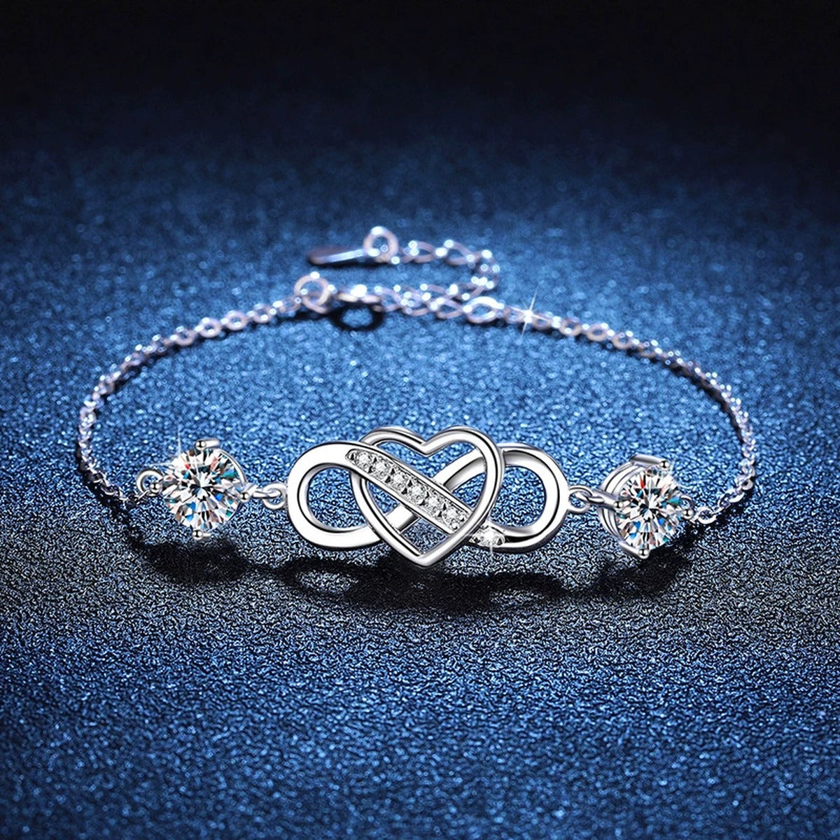 Infinity Heart Moissanite Chain Bracelet with CZ white background product photo showing bracelet silhouette and moissanite setting