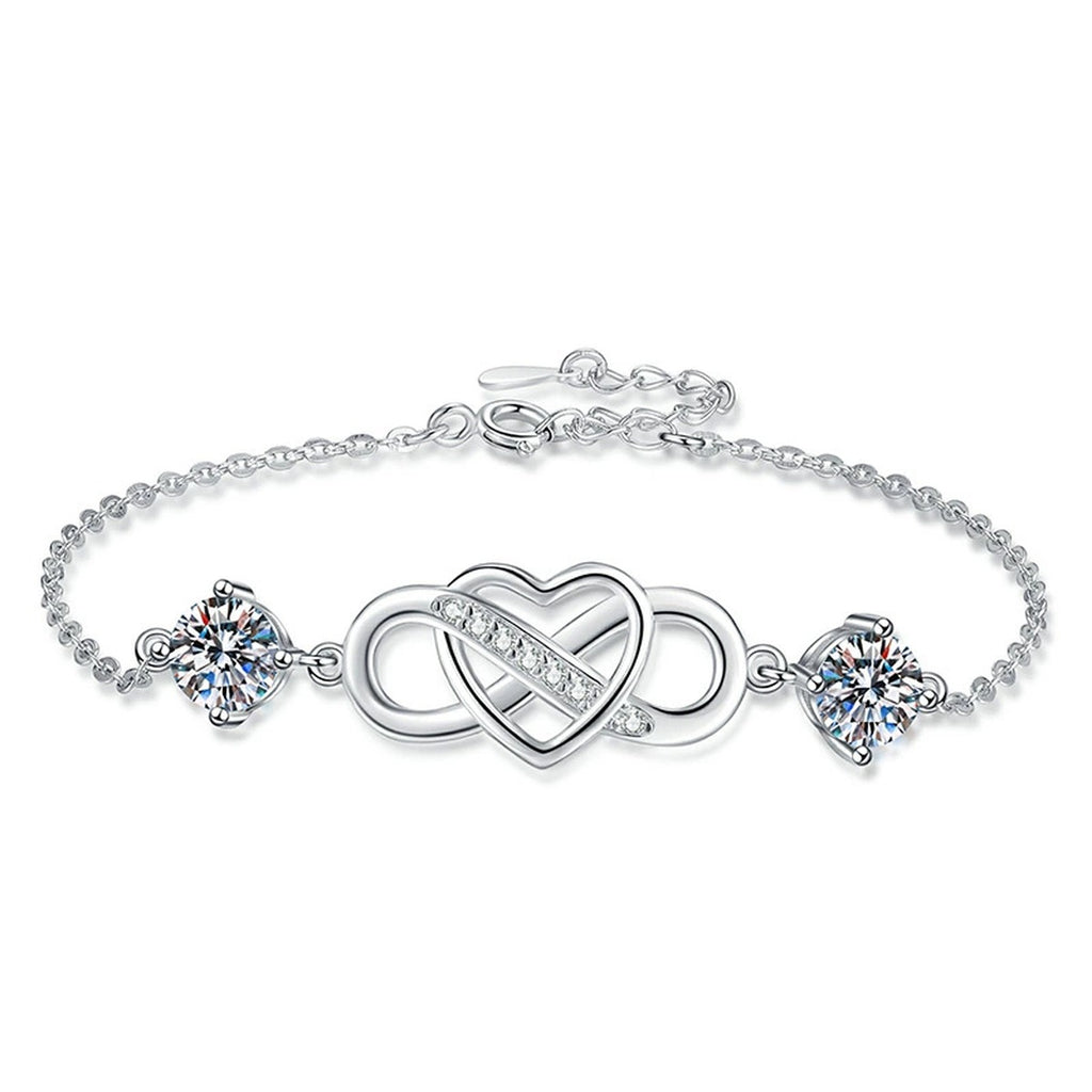 Infinity Heart Moissanite Chain Bracelet with CZ worn on wrist by model showing bracelet scale and fit