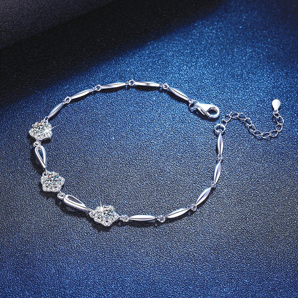Round Moissanite Chain Bracelet with CZ styled on blue display background showing moissanite sparkle