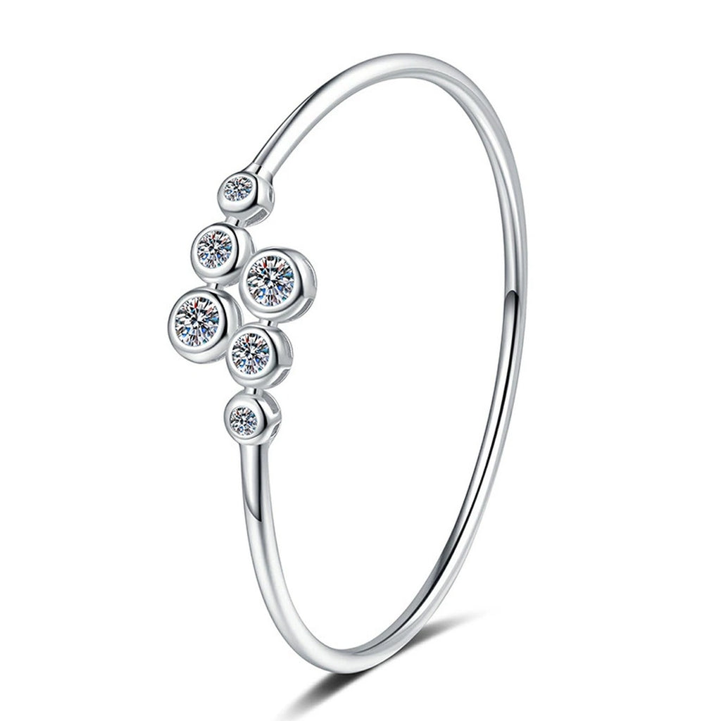 Three-Stone Moissanite Bangle Bracelet styled on blue display background showing moissanite sparkle