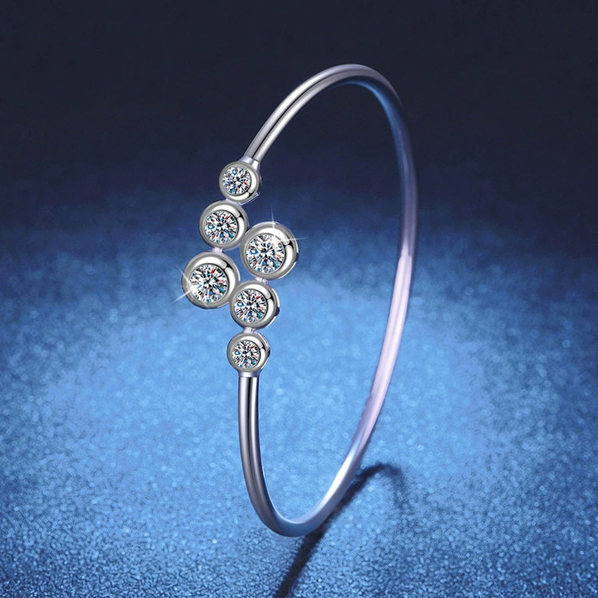 Three-Stone Moissanite Bangle Bracelet close-up detail showing chain, clasp, and stone placement