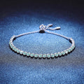 Aqua Moissanite Tennis Bracelet white background product photo showing bracelet silhouette and moissanite setting