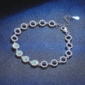 Aqua Moissanite Chain Bracelet with CZ white background product photo showing bracelet silhouette and moissanite setting