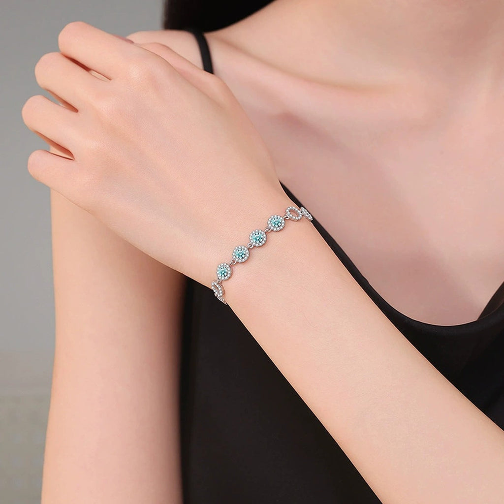 Aqua Moissanite Chain Bracelet with CZ worn on wrist by model showing bracelet scale and fit