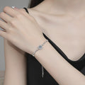 Round Moissanite Chain Bracelet with CZ white background product photo showing bracelet silhouette and moissanite setting
