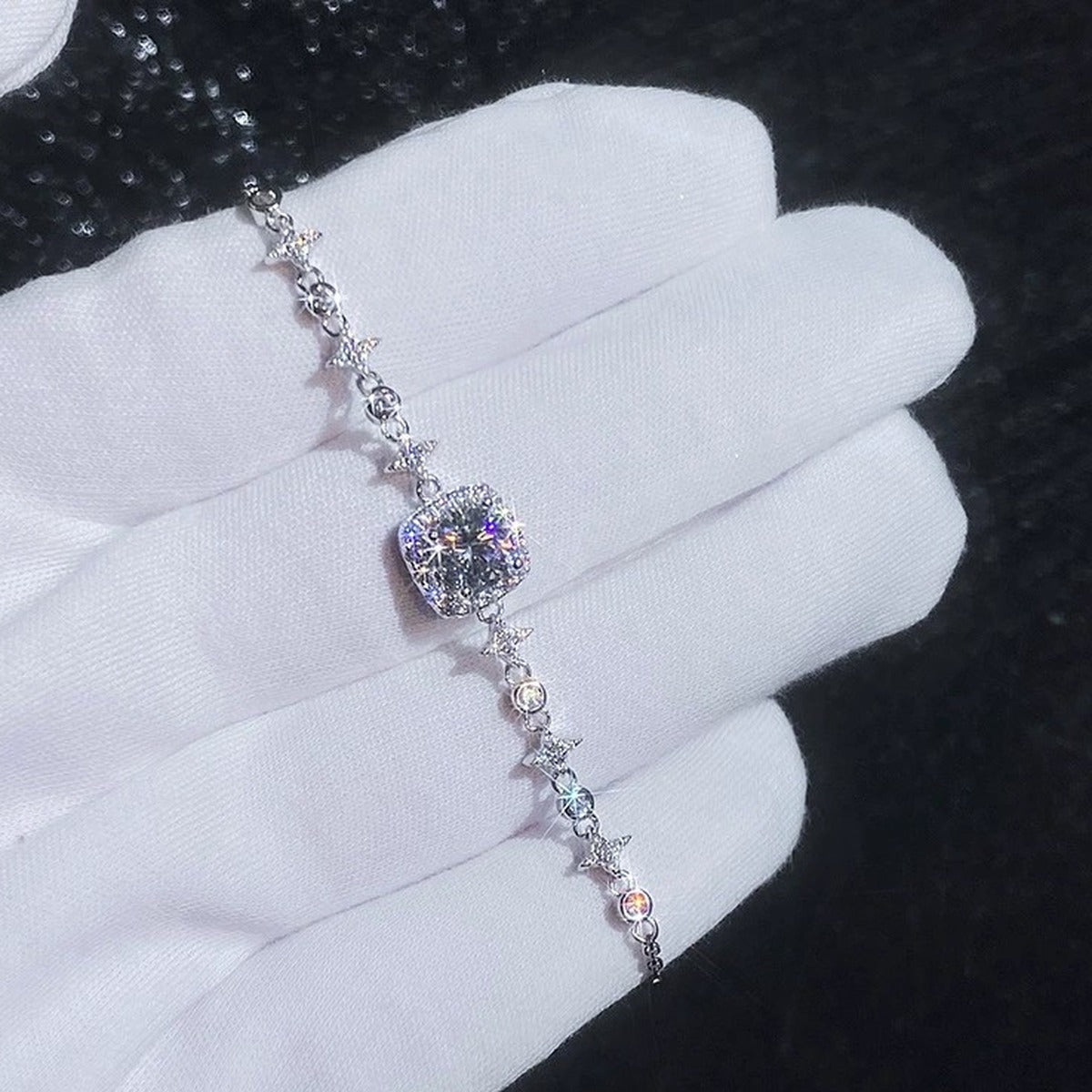 Round Moissanite Chain Bracelet with CZ held in hand close-up showing bracelet scale and detail