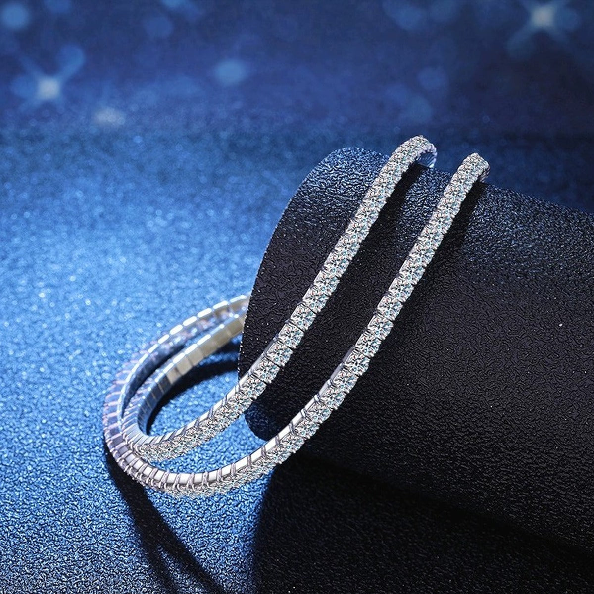 Moissanite Tennis Bangle Bracelet held in hand close-up showing bracelet scale and detail