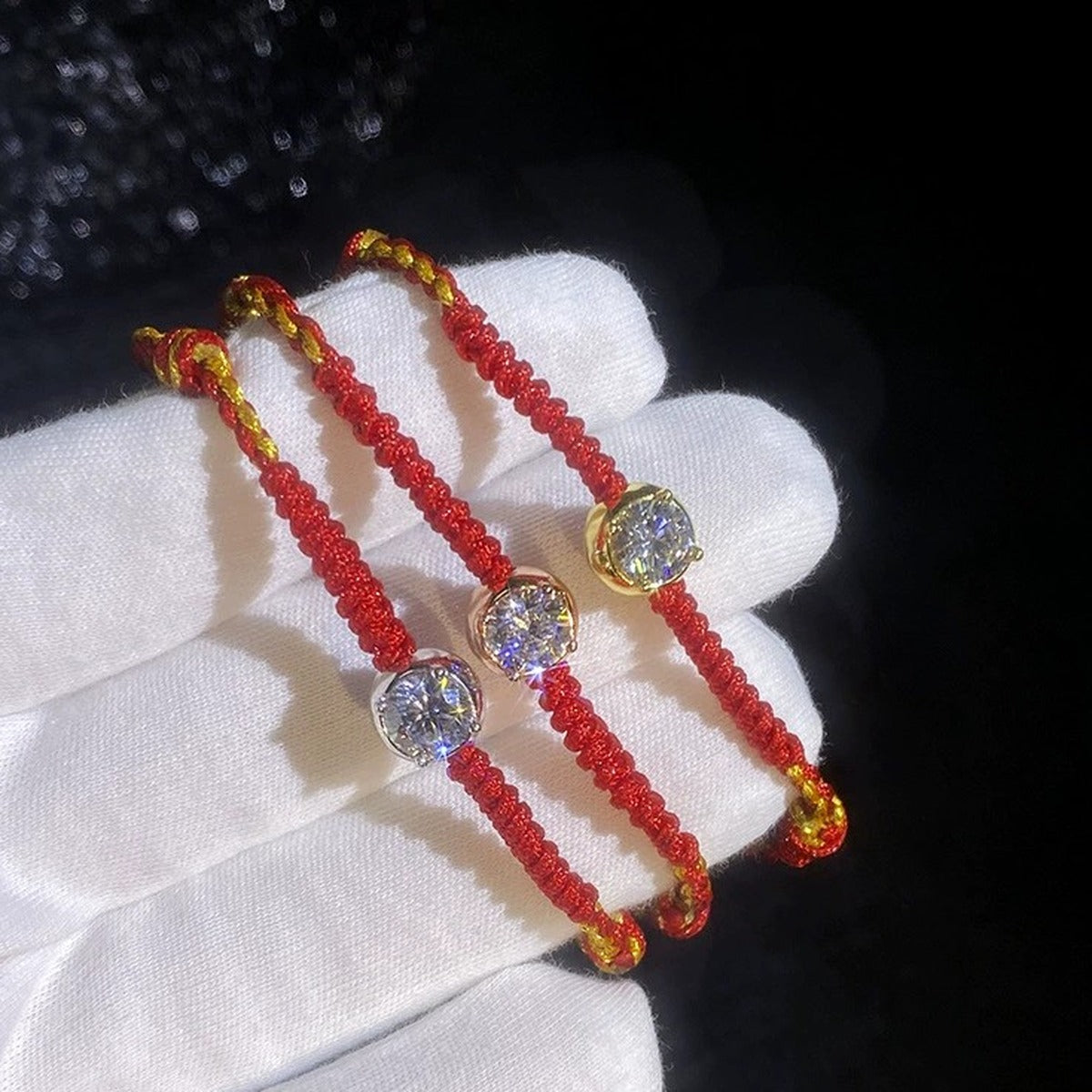 Red Cord Moissanite Bracelet in Gold-Plated S925 Sterling Silver dark display close-up highlighting stone setting and metal finish