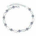 Three-Stone Moissanite Chain Bracelet white background product photo showing bracelet silhouette and moissanite setting