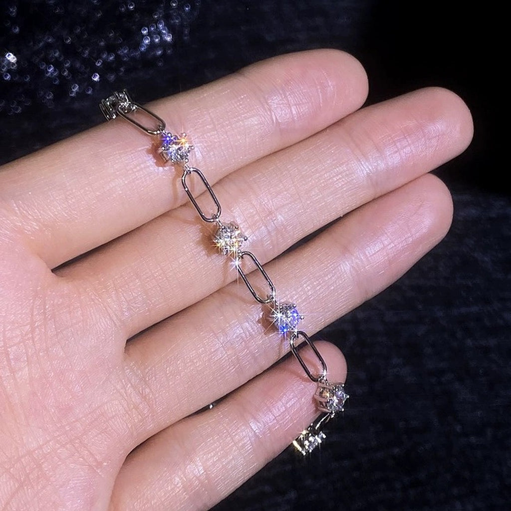 Three-Stone Moissanite Chain Bracelet worn on wrist by model showing bracelet scale and fit