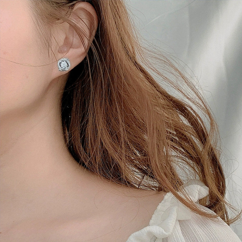 Dragon Round Moissanite Stud Earrings with CZ in White Gold-Plated S925 sterling silver worn on ear by model showing scale, placement, and stud earrings styling