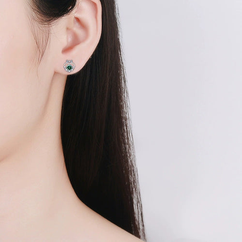 Bow Heart Green Moissanite Stud Earrings with CZ in White Gold-Plated S925 sterling silver worn on ear by model showing scale, placement, and stud earrings styling