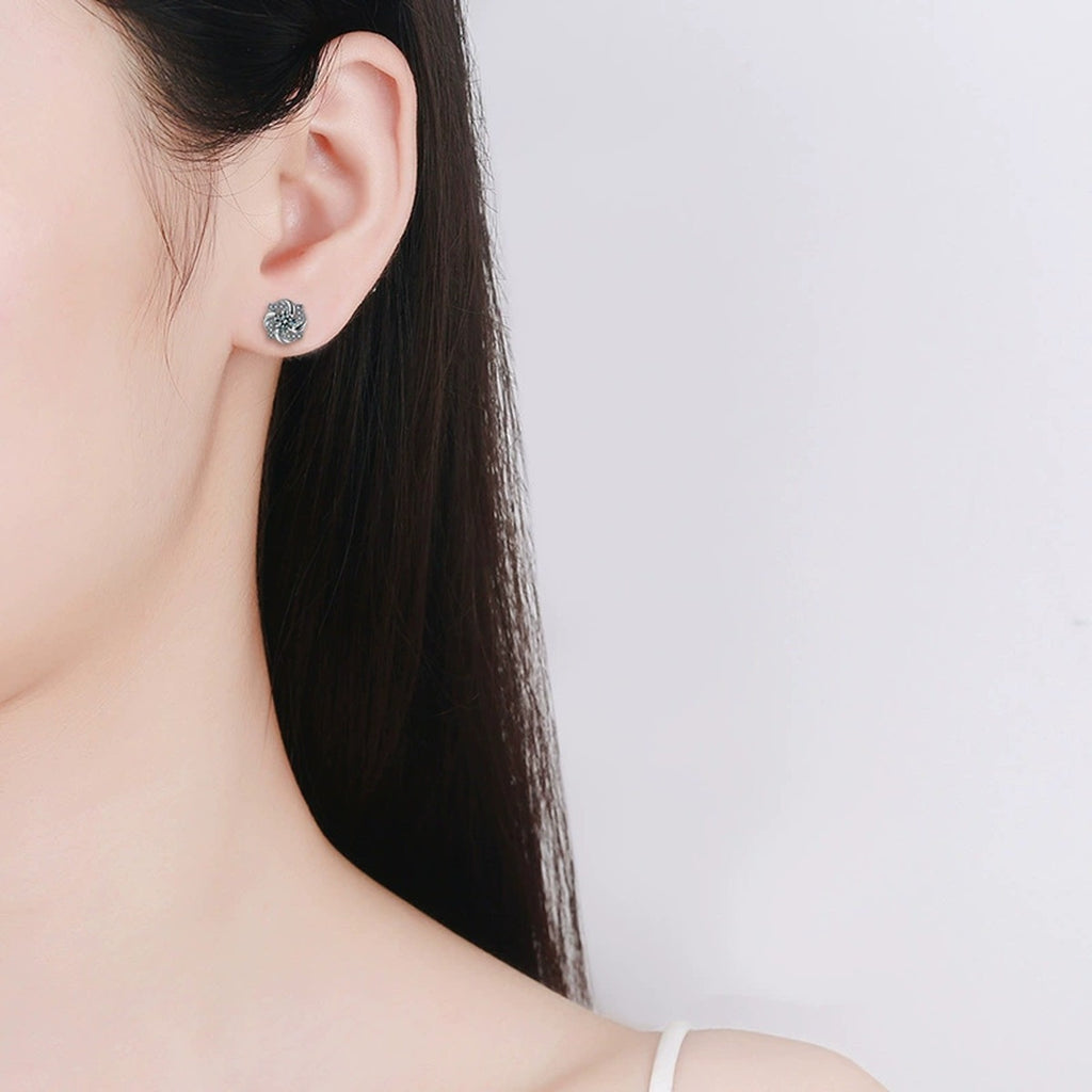 Rotating Pinwheel Round Moissanite Stud Earrings with CZ in White Gold-Plated S925 sterling silver worn on ear by model showing scale, placement, and stud earrings styling