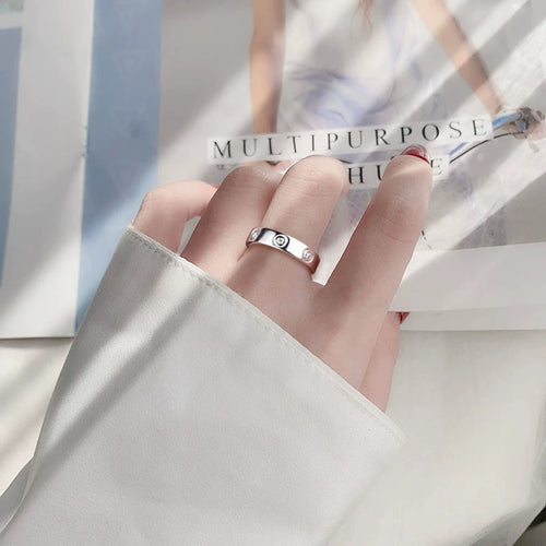 Bezel-Set Round Moissanite Wide Wedding Band worn on hand to show scale, band width, and ring profile