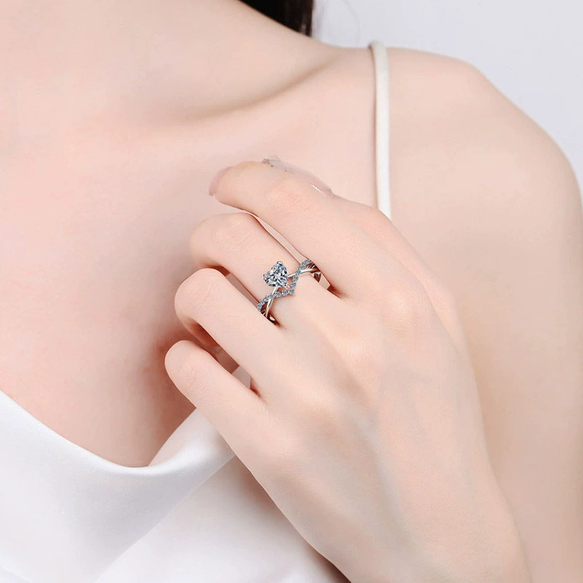 Heart Cut Moissanite Engagement Ring with CZ worn on hand to show scale, band width, and ring profile
