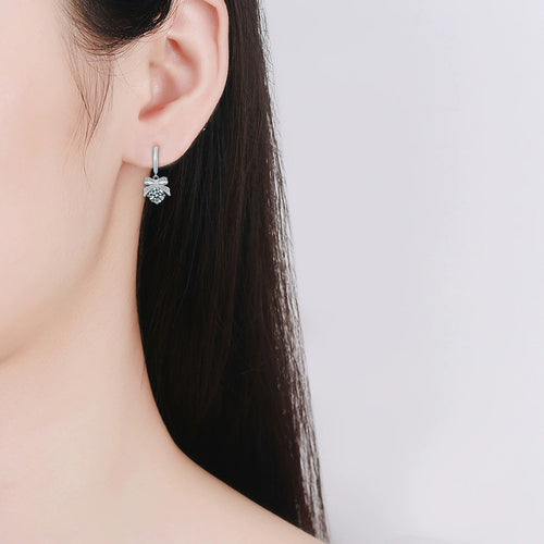 Bowknot Round Moissanite Hoop Dangle Earrings with CZ in White Gold-Plated S925 sterling silver worn on ear by model showing scale, placement, and hoop dangle earrings styling