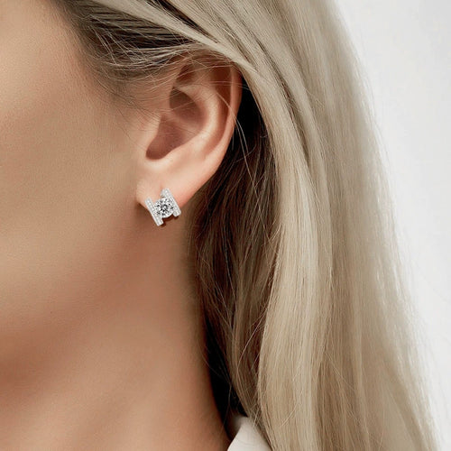 Bowknot Round Moissanite Huggie Hoop Earrings with CZ in Gold-Plated S925 sterling silver worn on ear by model showing scale, placement, and huggie hoop earrings styling