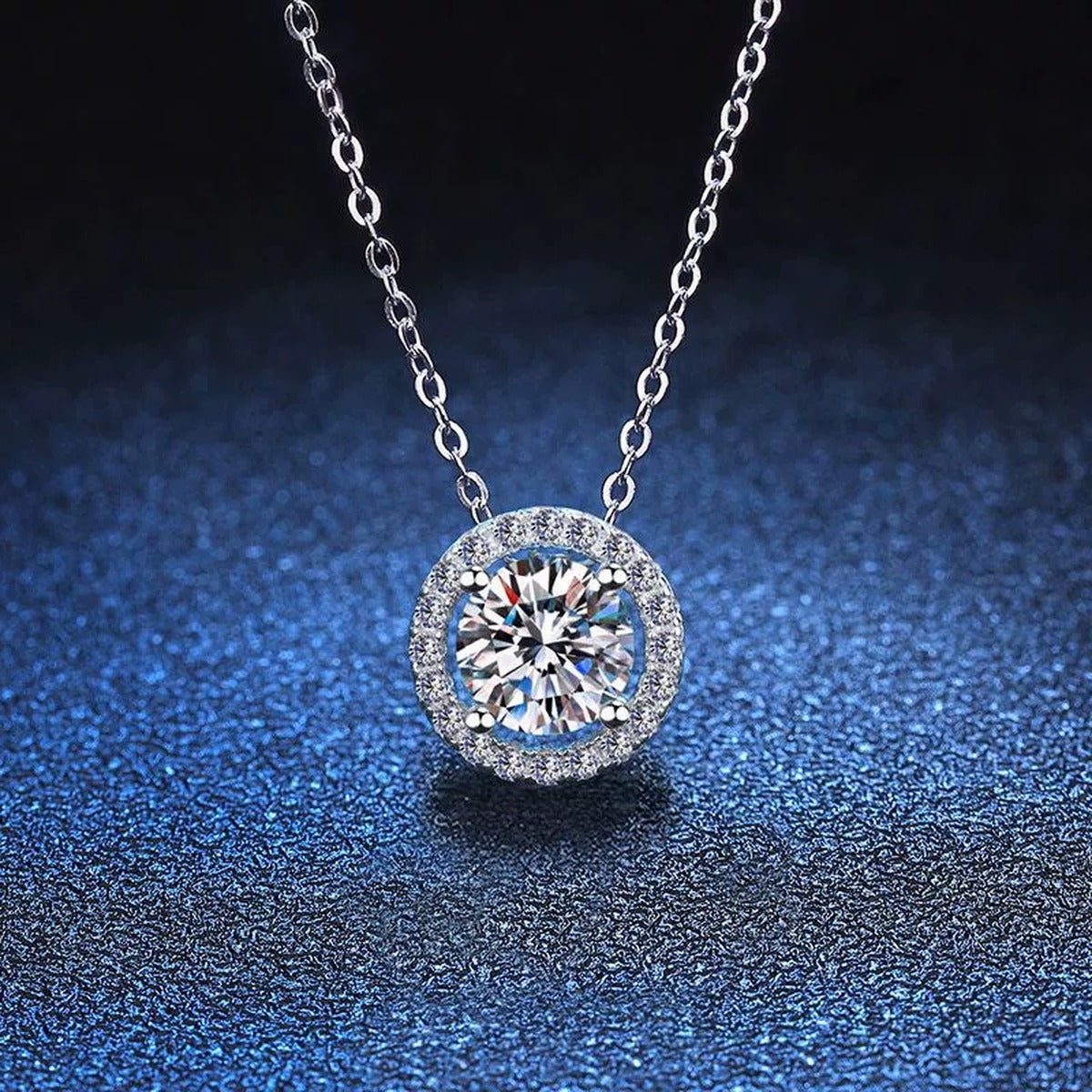 Round Halo Moissanite Pendant Necklace with Cubic Zirconia in White Gold-Plated S925 Sterling Silver blue background product view