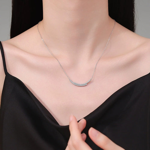 Curved Moissanite Bar Necklace in Platinum-Plated S925 Sterling Silver worn on neckline by model