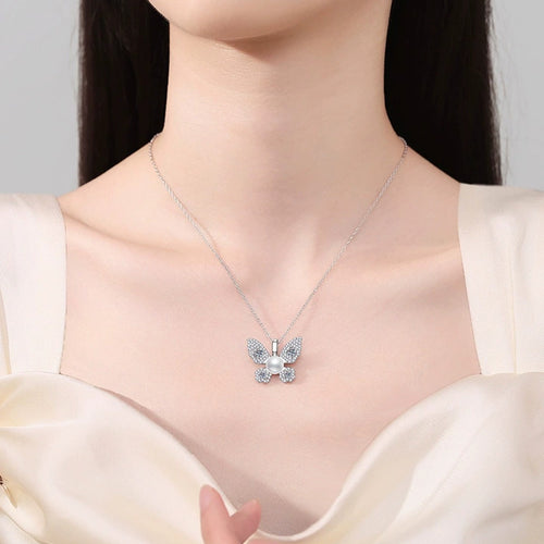 Butterfly Moissanite Freshwater Pearl Pendant Necklace with Cubic Zirconia in White Gold-Plated S925 Sterling Silver worn on neckline by model