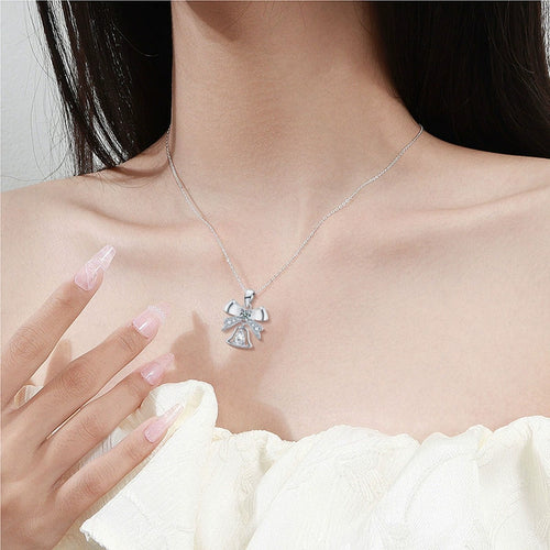 Bowknot Bell Pear Cut Moissanite Necklace with CZ in White Gold-Plated S925 sterling silver neckline model view showing pendant scale and chain length