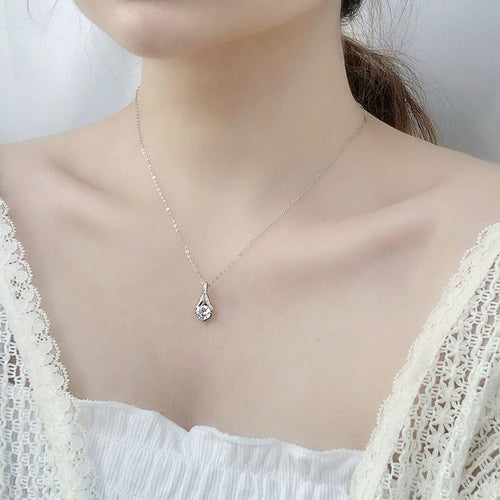 Curved Drop Round Moissanite Necklace with CZ in White Gold-Plated S925 sterling silver neckline model view showing pendant scale and chain length