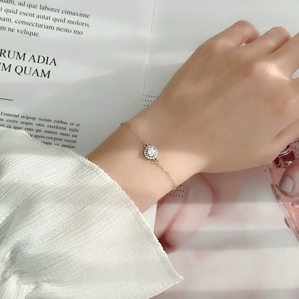 Round Halo Moissanite Adjustable Bracelet in White Gold-Plated S925 Sterling Silver worn on the wrist showing bracelet scale, fit, and styling